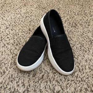 Cole Haan black slip on sneakers